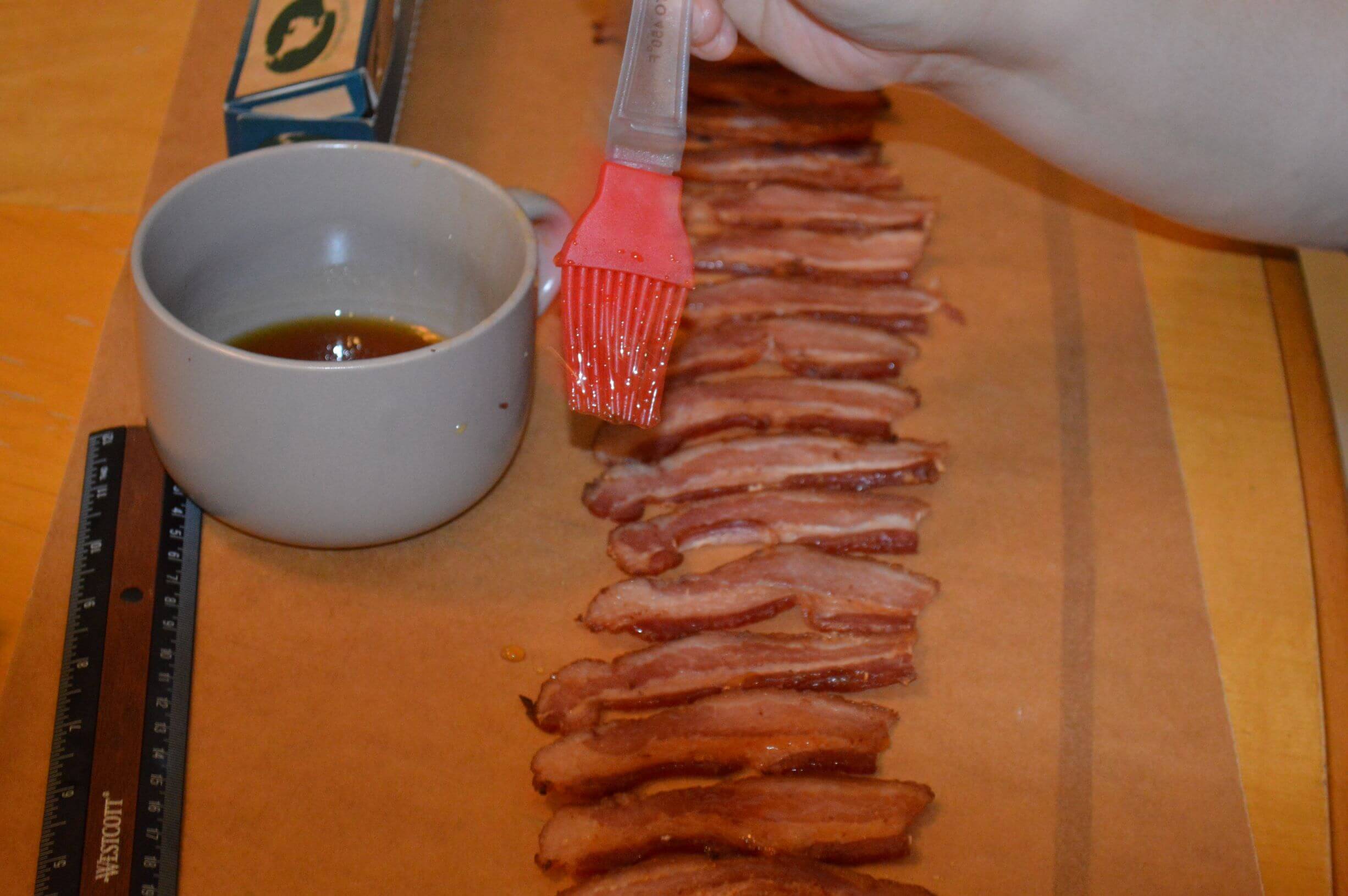 Brush bacon with maple syrup